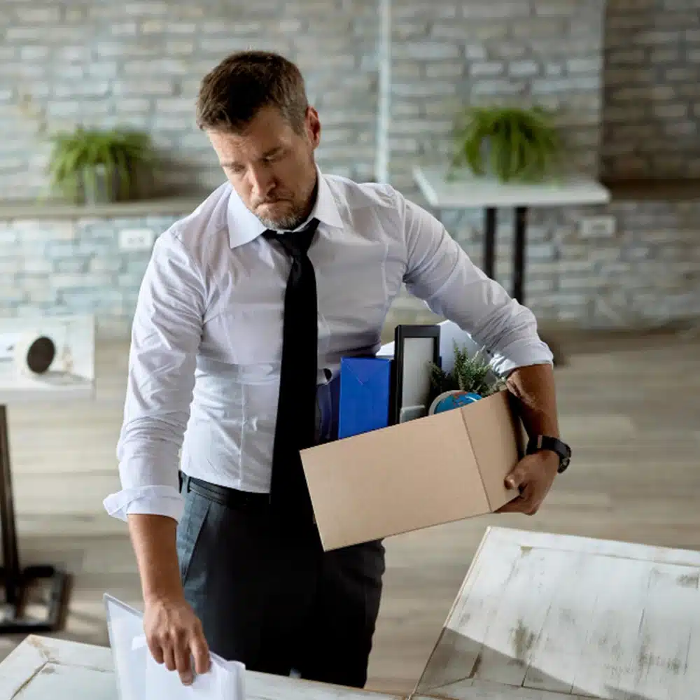 Worker discussing termination concerns with a lawyer