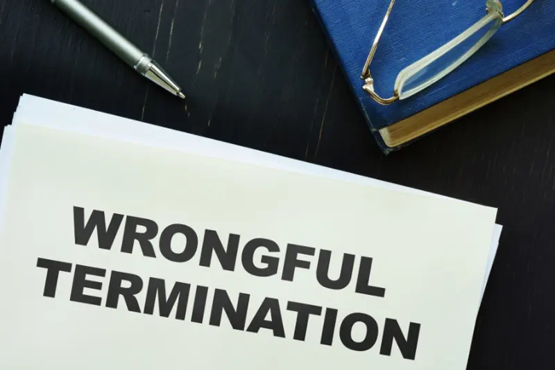 California employment attorney explaining wrongful termination legal rights to client.